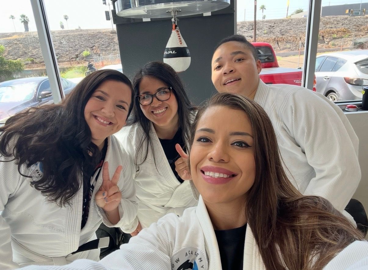 Professor Zaide with students in their gis, smiling in a selfie